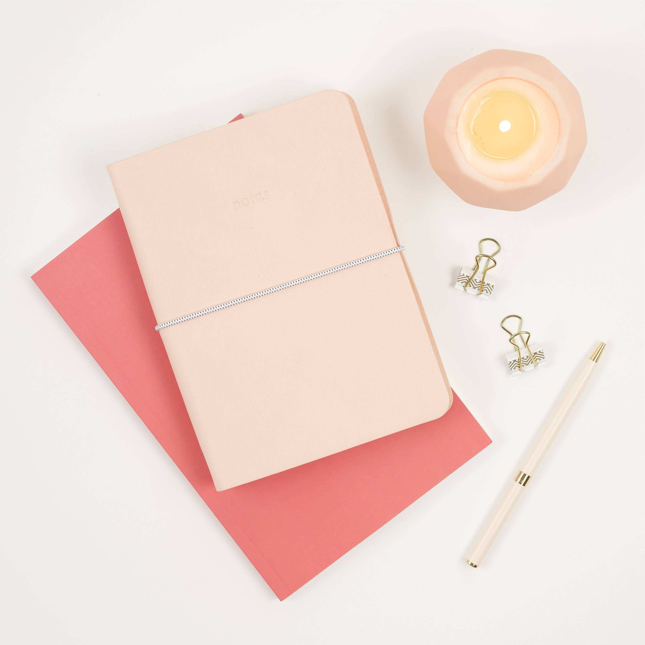 Notebooks and candle